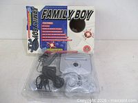 Front view of Family Boy console set in blister packaging showing console and two controllers