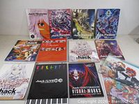 Full lot layout of eleven .hack books and magazines