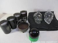 Group shot of all items: skull bottles, crystal ball, cauldron and four candles