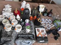 Overview of all Halloween items laid out on bed