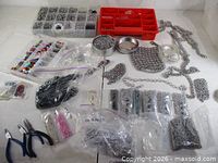 overview of all supplies, bags of jump rings, organizers, tools