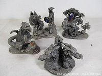All four Tudor Mint pewter figurines grouped