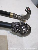 Close-up of skull and cobra metal handles