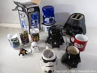 Group shot showing all Star Wars items including appliances, coin bank, mugs, glasses, figurine