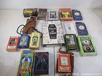 Group shot of all 16 packs including boxed decks, pouches and chest