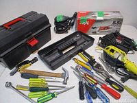 Overview of all tools, toolbox, angle grinder accessories, jigsaw, and assorted hand tools