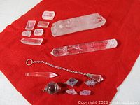 Group view of all crystals on red cloth