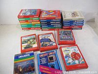 All 27 boxed games laid out with voice module visible