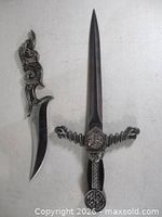 Both daggers side by side showing full profiles
