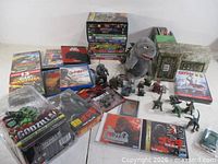 Overall view of DVDs, figures, plush, packaged figure, game discs and tank