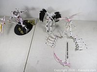 Overview showing three assembled figures and White Rock Shooter accessories