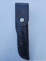 Front view of black Buck leather sheath