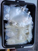 Assortment of clear bags and frosted spout pouches in tote