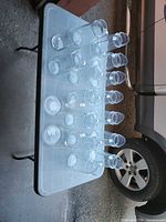 Tabletop view showing all clear glass pitchers lined up