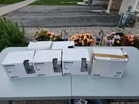 Five boxes of IKEA SVALKA glasses on table