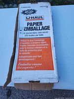 Closed U-Haul branded box showing product details