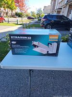 Front of Xtrasun DE grow light system box on table