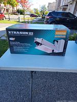 Front view of boxed Xtrasun DE 1000 W lighting system