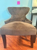 Front view showing diamond-tufted back, microfiber upholstery, wood legs
