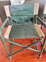 Single director's chair showing seat, backrest, armrests, frame details
