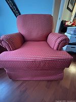 Front view of the red upholstered armchair