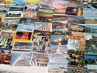 Wide view of grouped Florida postcards spread on surface