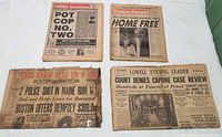 All four newspapers laid out showing full front pages