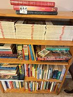 Full bookcase with assorted hardcovers and paperbacks including Life World Library series and travel reference
