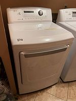 Front view of LG gas dryer showing control panel, door and exterior