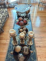 Entire lot on console table showing crystal bowl, candle pillars, urns and spheres