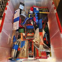 Overview of tote with assorted tools and supplies