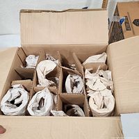 Divided carton with wrapped glasses