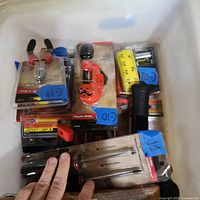 Overview of bin containing packaged hand tools
