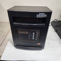 Full view of EdenPURE heater showing cabinet and front control door