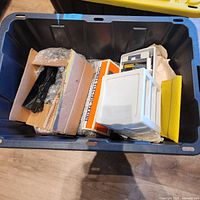 Overview of blue tote with Lionel items