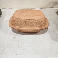 Covered clay baking dish showing lid design and overall appearance