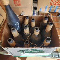 Box of 10 matte black bottles with twine wraps