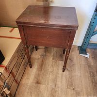 Closed sewing machine cabinet front view