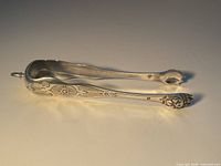 Full view of sterling silver sugar tongs