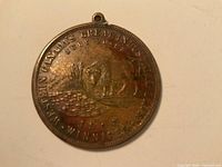 Obverse of medal showing text, bison image and date