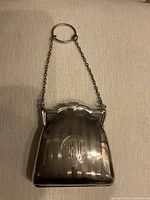 Front view of sterling silver dance purse showing monogram and chain