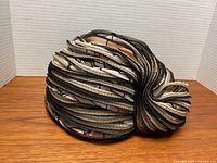 Side view of pleated ribbon turban hat