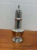 Full view of sterling sugar caster showing shape and finish