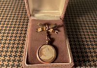 Brooch and photo fob in open case
