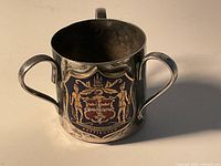 Front view showing enamel Nottingham coat of arms and two handles