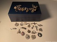 Bracelet and loose charms displayed together to show quantity and scale