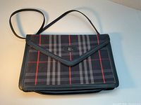 Front view showing plaid pattern, leather trim, overall condition