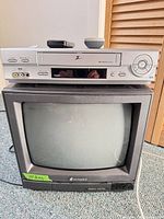 Front view showing VCR stacked on Hitachi TV