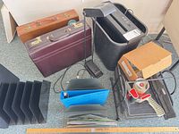 Group shot showing briefcases, shredder, lamp, tape gun, organizers, yardstick