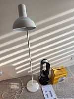 Full view of floor lamp, Dyson AM09 unit, Airworks heater box and manual